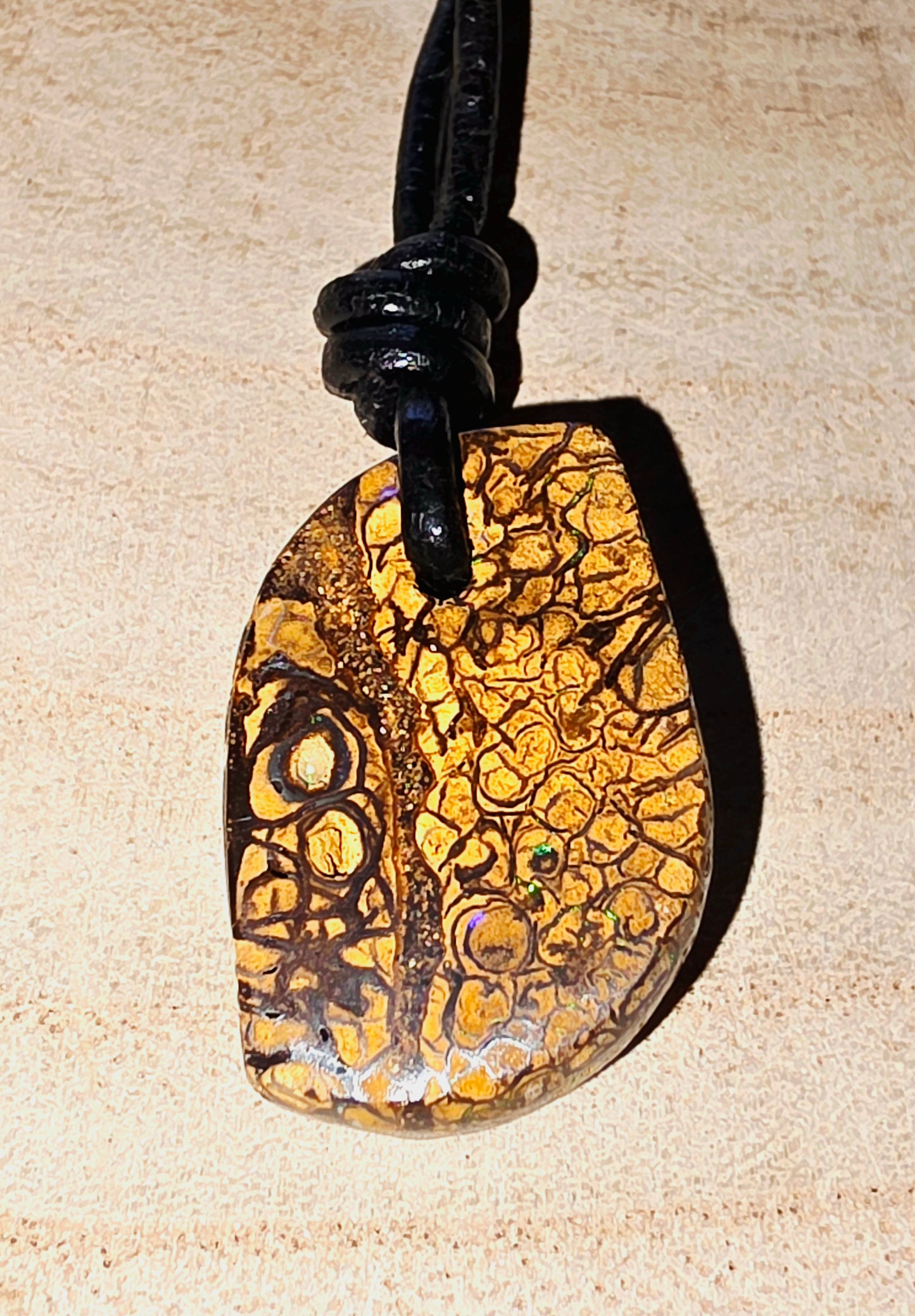 Pendant with a unique pattern on a beige background