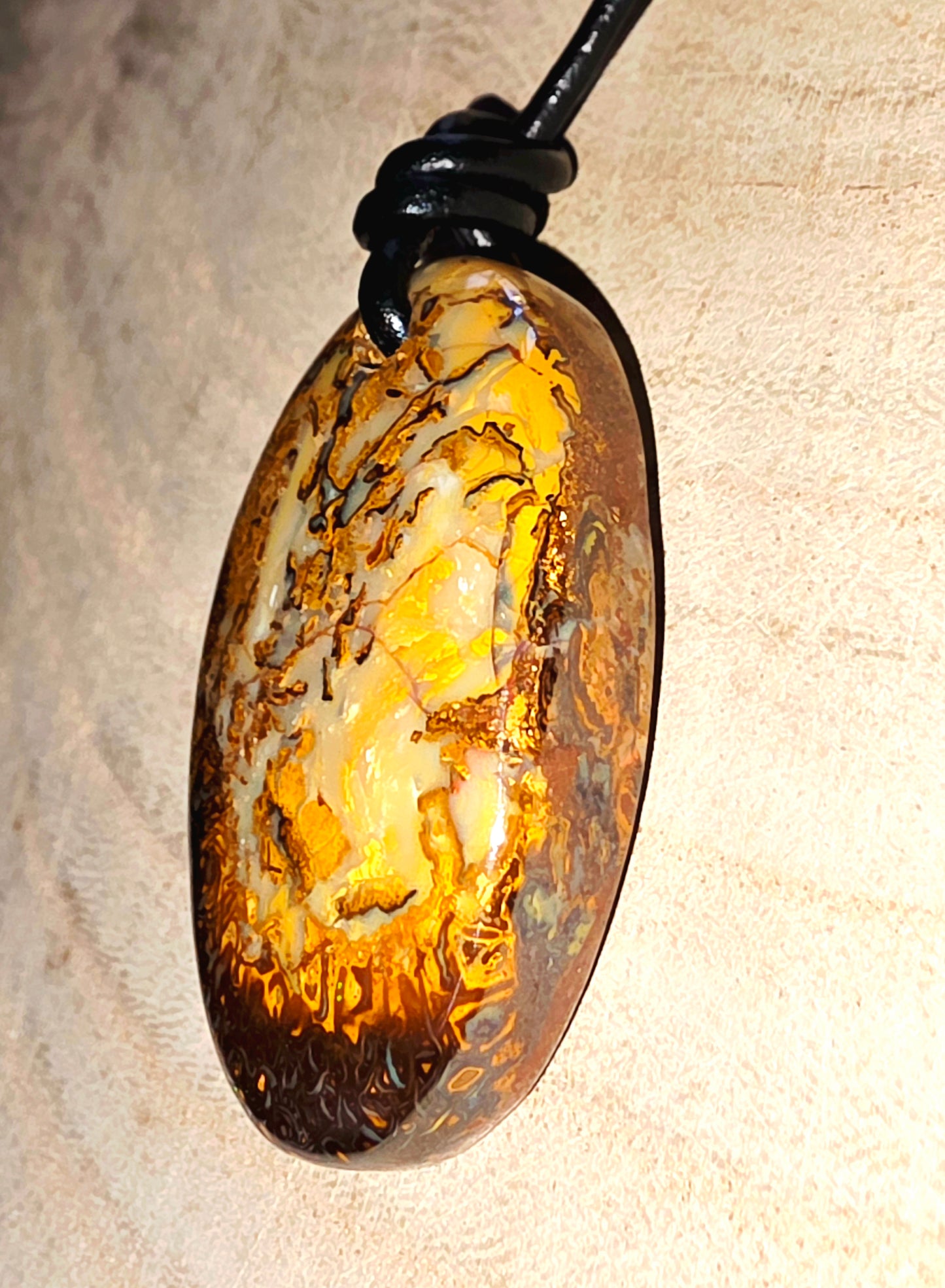 Decorative pendant with a textured surface on a beige background