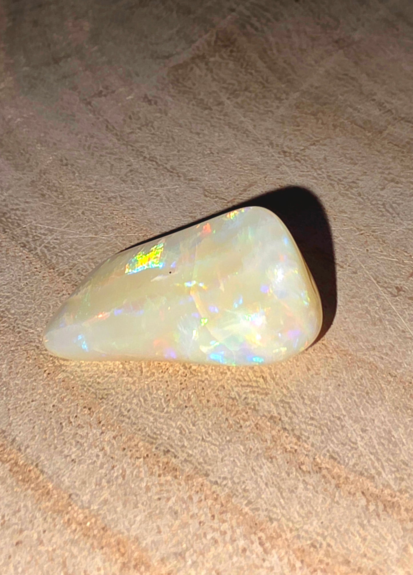 Opal stone on a textured surface