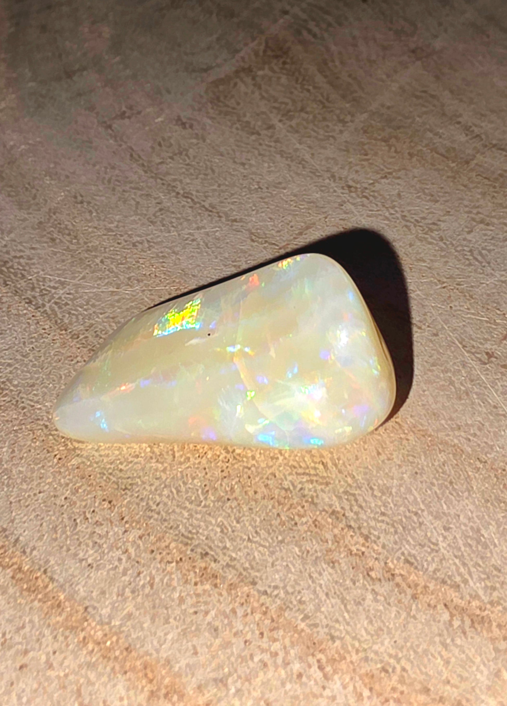 Opal stone on a textured surface