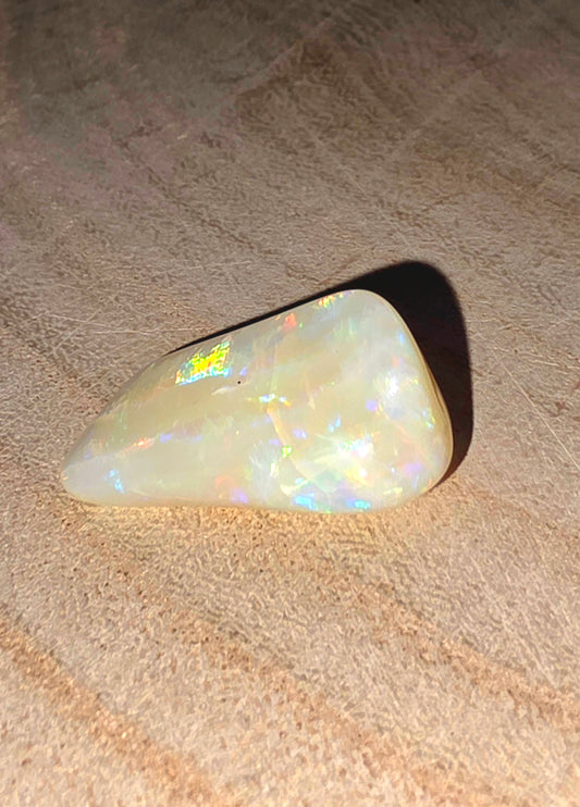 Opal stone on a textured surface