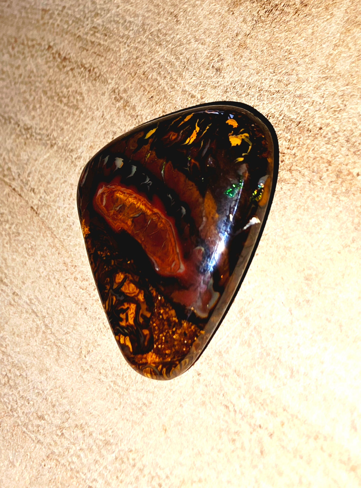Polished stone on a beige background