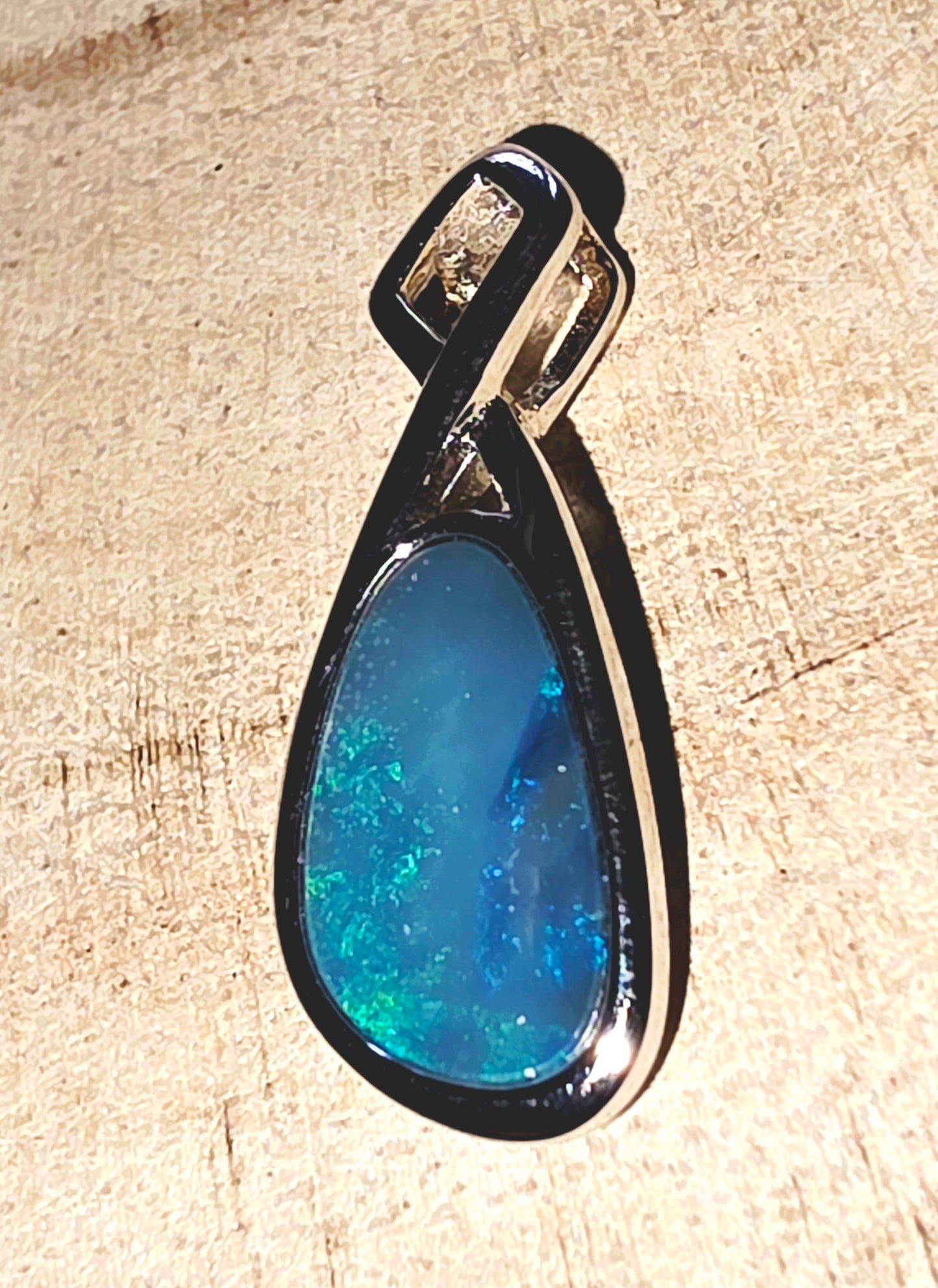 Boulder Opal Pendant - Electric Blue & Green Flash in Crossed  Silver Mount