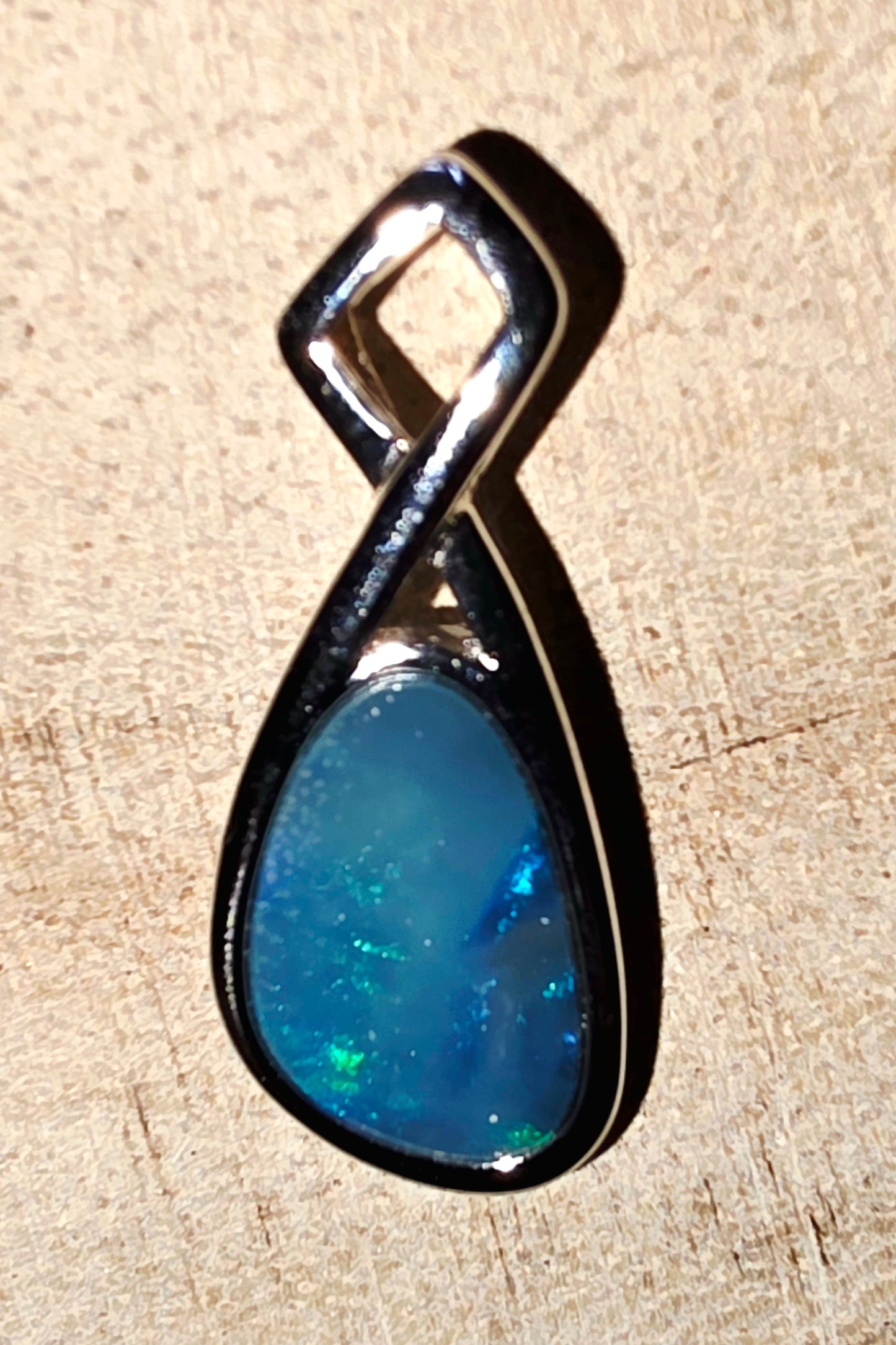 Boulder Opal Pendant - Electric Blue & Green Flash in Crossed 925 Silver Mount