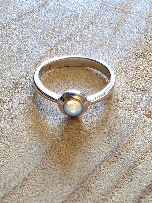 A 925 silver stacker ring with a crystal opal