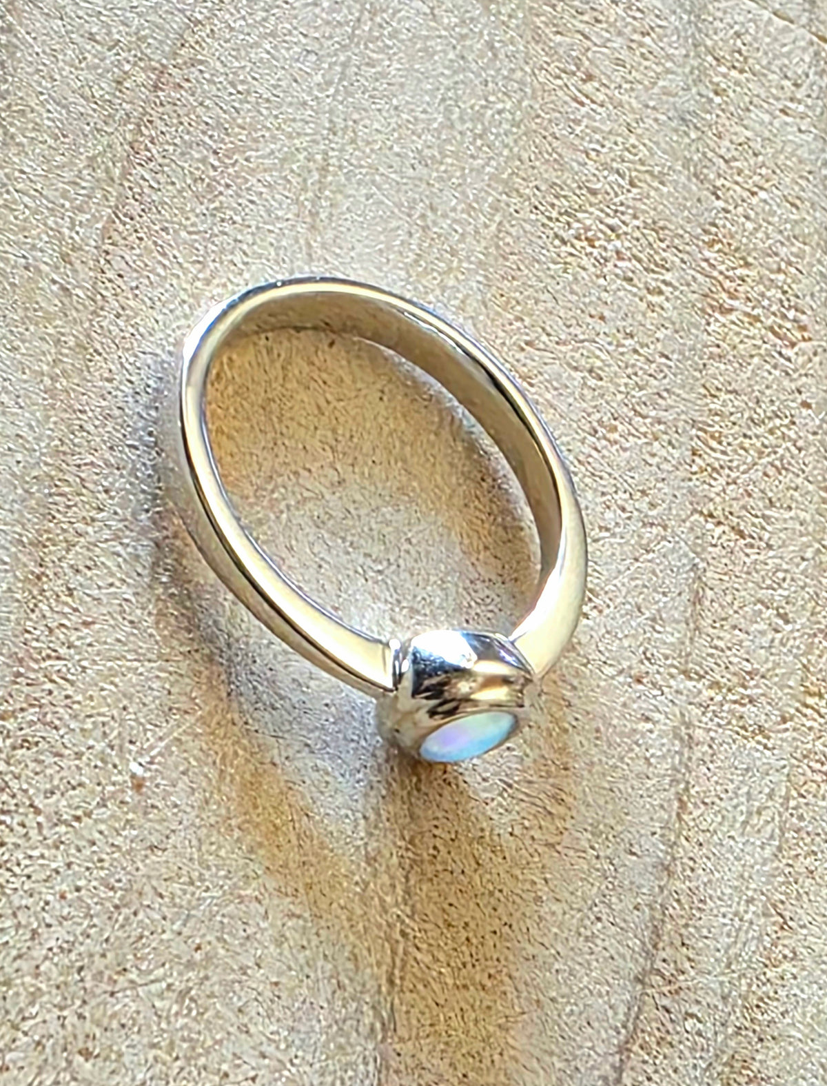 A 925 silver stacker ring with a crystal opal