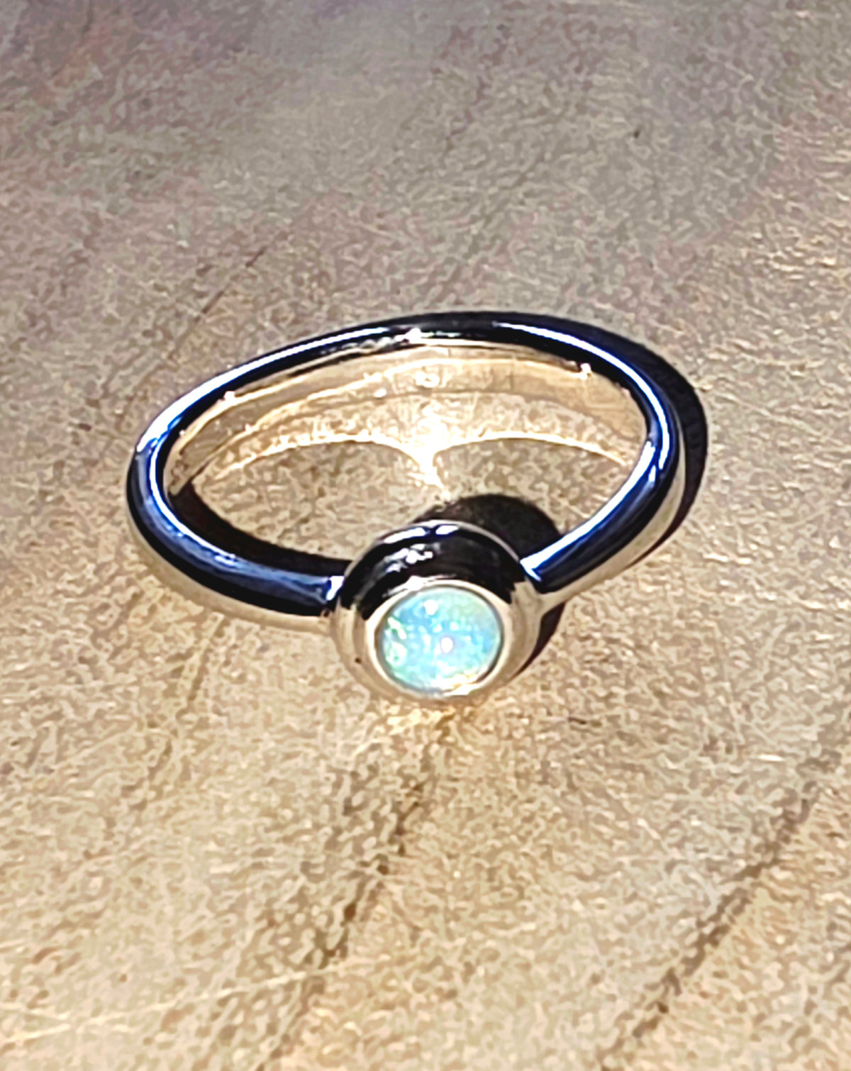 A 925 silver stacker ring with a crystal opal