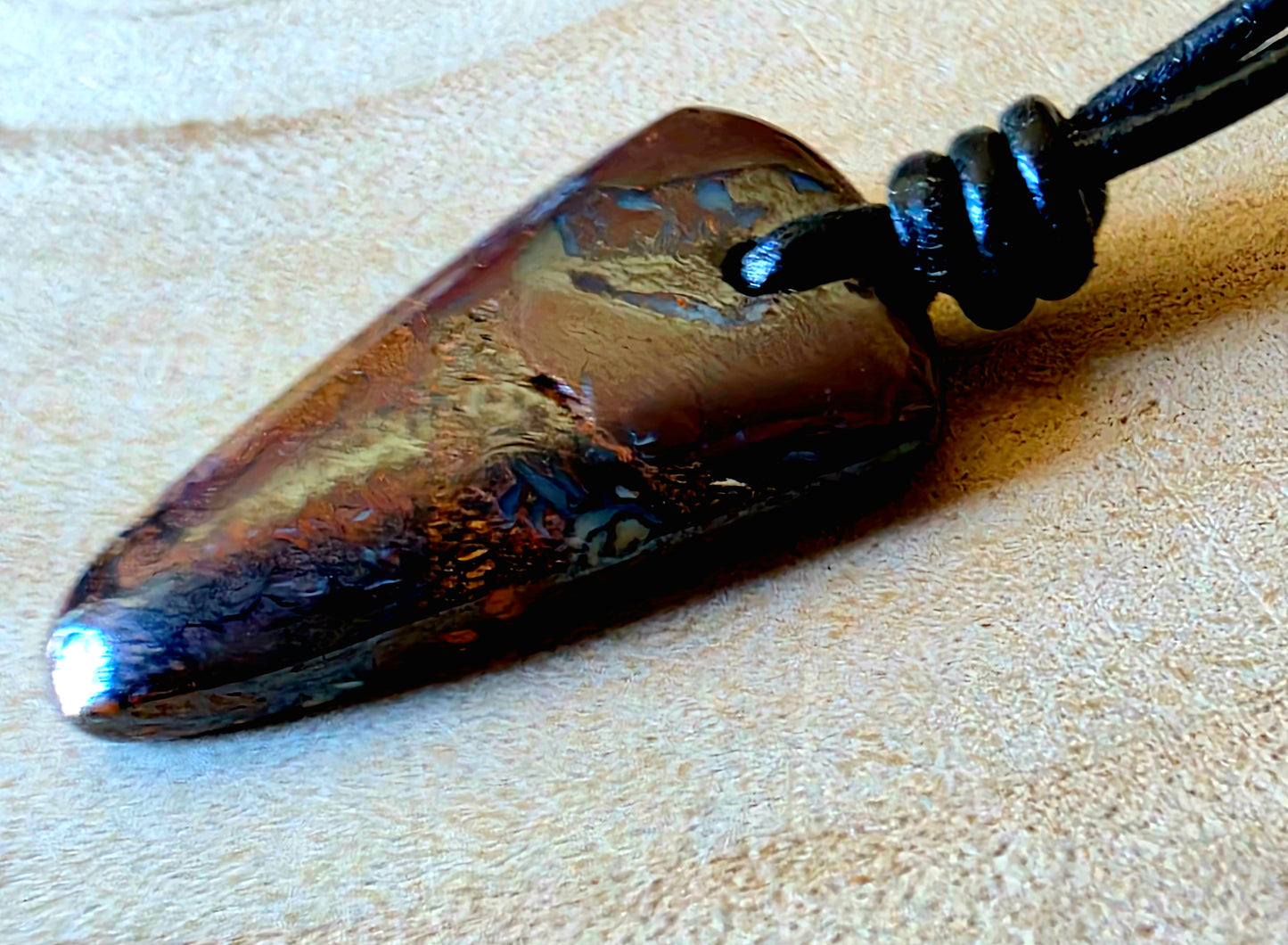 Boulder seam opal necklace on black leather cord