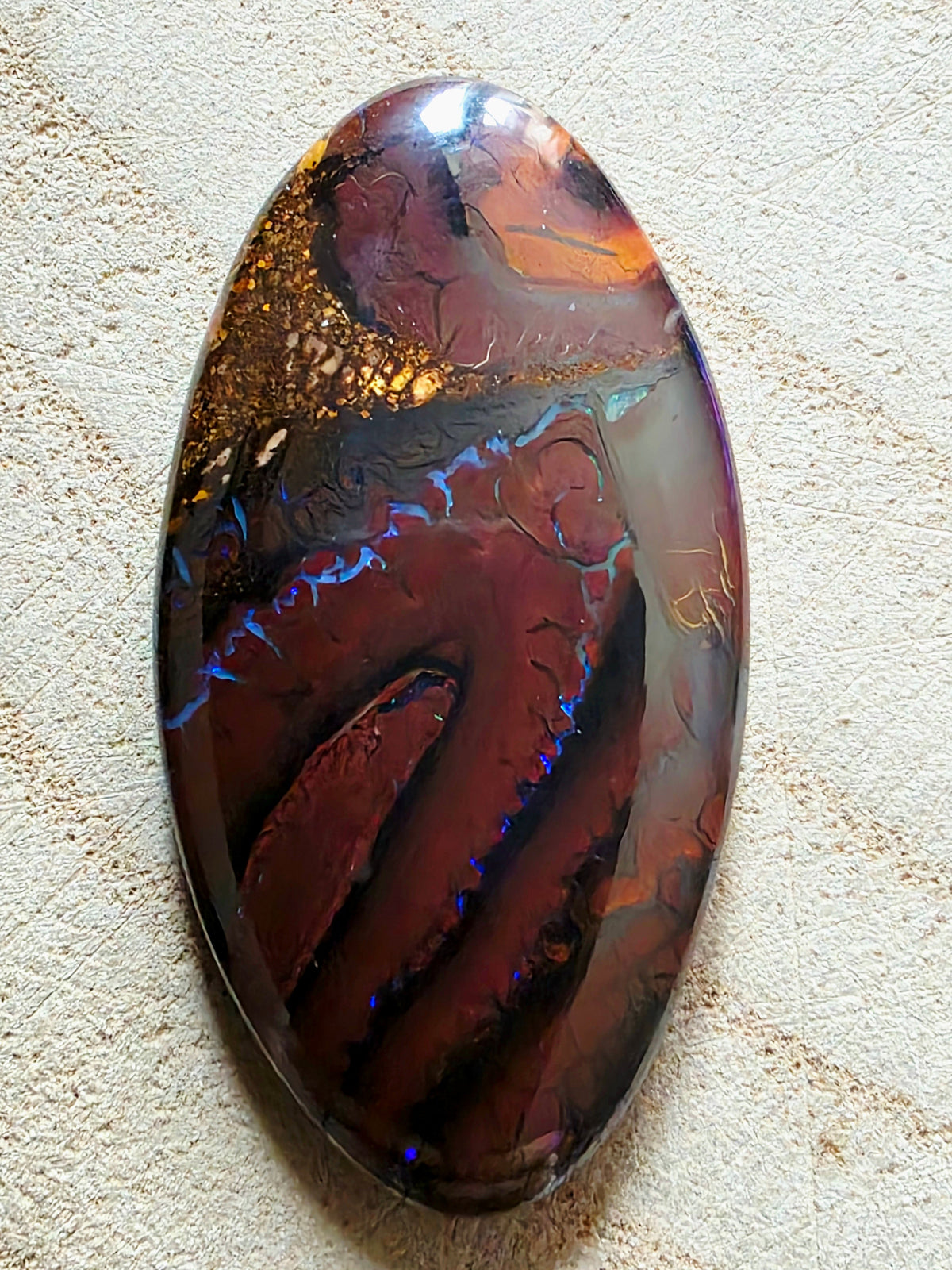 A large opal stone showing blue seams