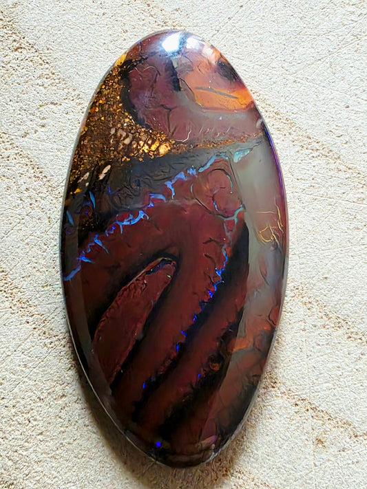 A large opal stone showing blue seams